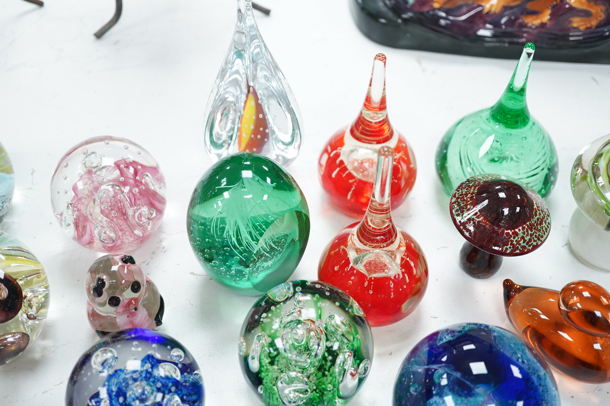 A group of glass paperweights to include Caithness and Perthshire, largest 14cm high. Condition - good